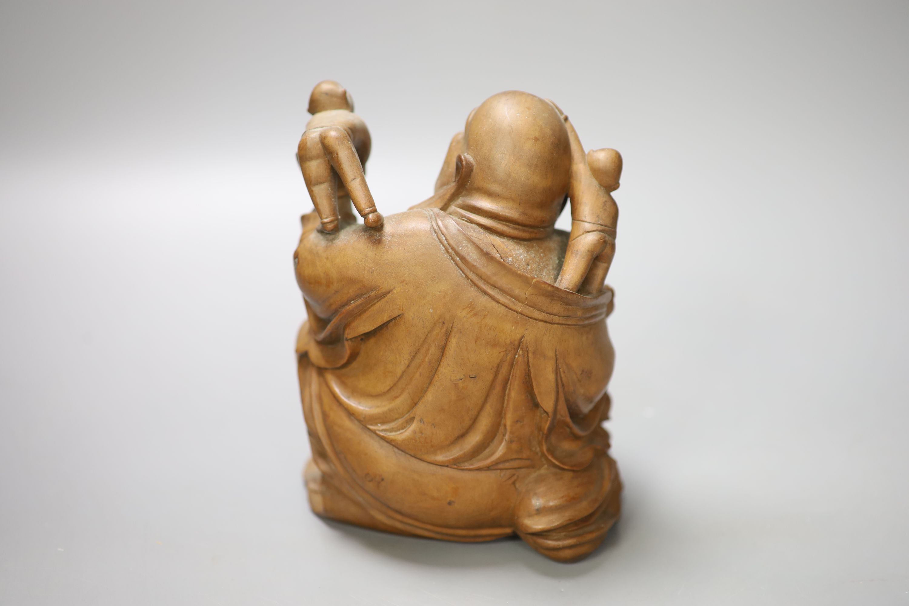 A Chinese carved hardwood figure of Budai, height 17cm